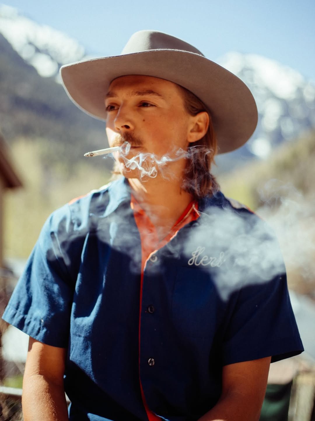 Photo of a man in a room using a tablet computer